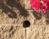 Wall drainage hole drilling